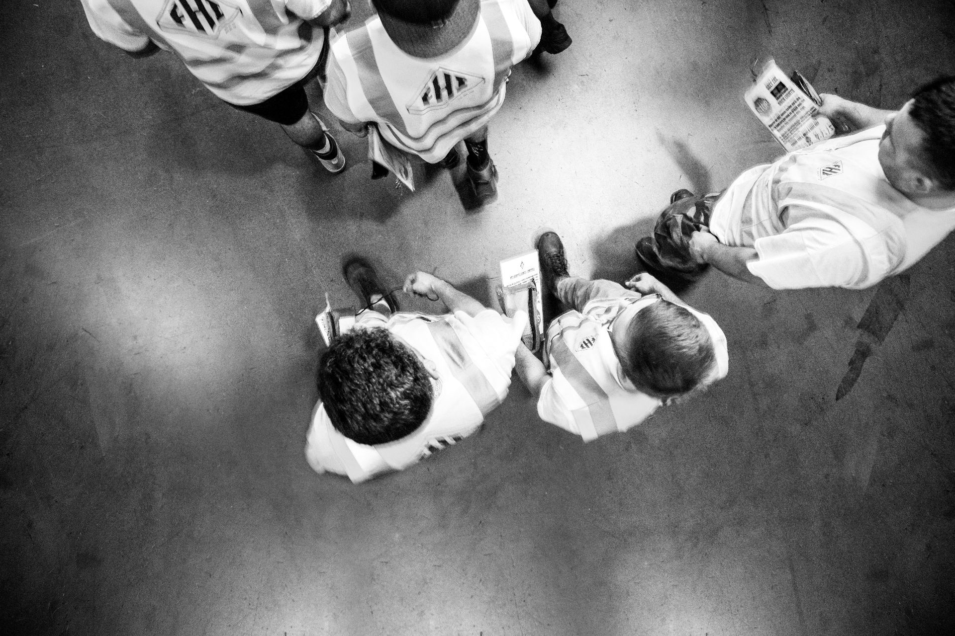 Operations team huddle on a distribution floor